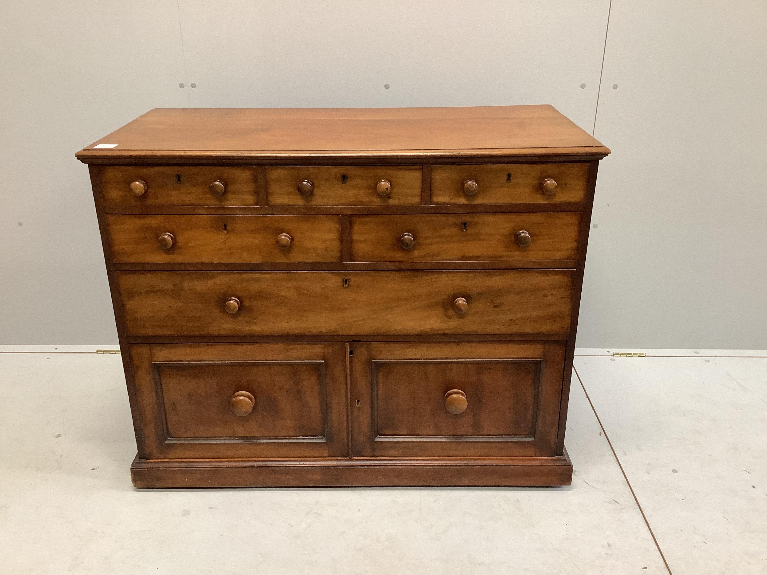 A Victorian mahogany chest fitted with an arrangement of seven drawers, width 110cm, depth 52cm, height 87cm